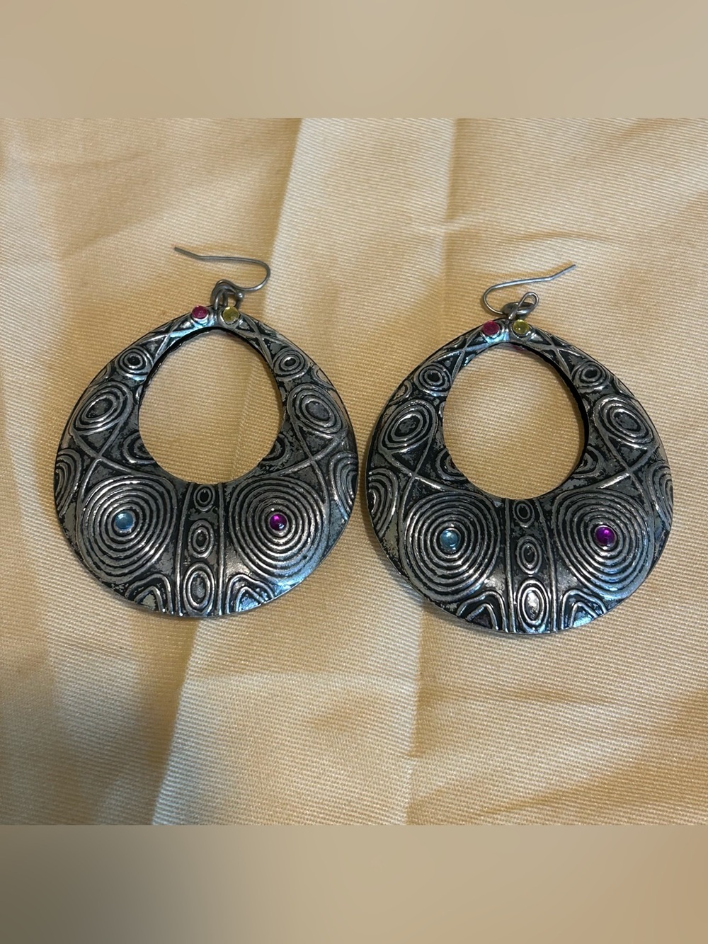 silver patterned dangle earrings with multi color gems